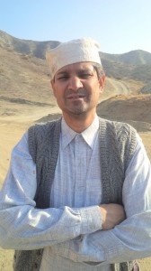 Kuldip Korotana in character with arms crossed on a mountain location